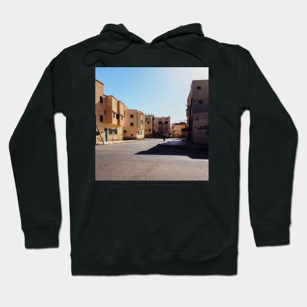 Man Riding Bicycle Through Moroccan Suburb Hoodie by visualspectrum